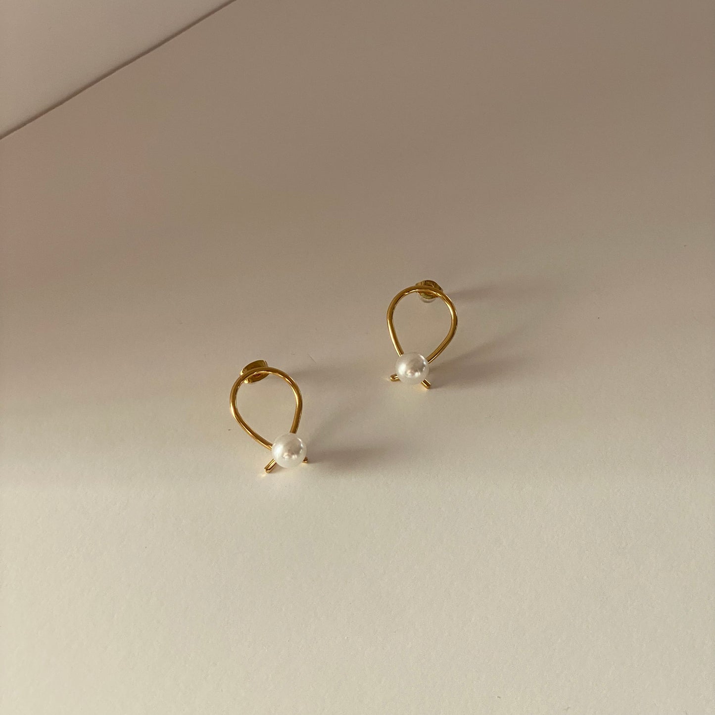 Minimalistic Fine Curve Pearl Stud Earrings